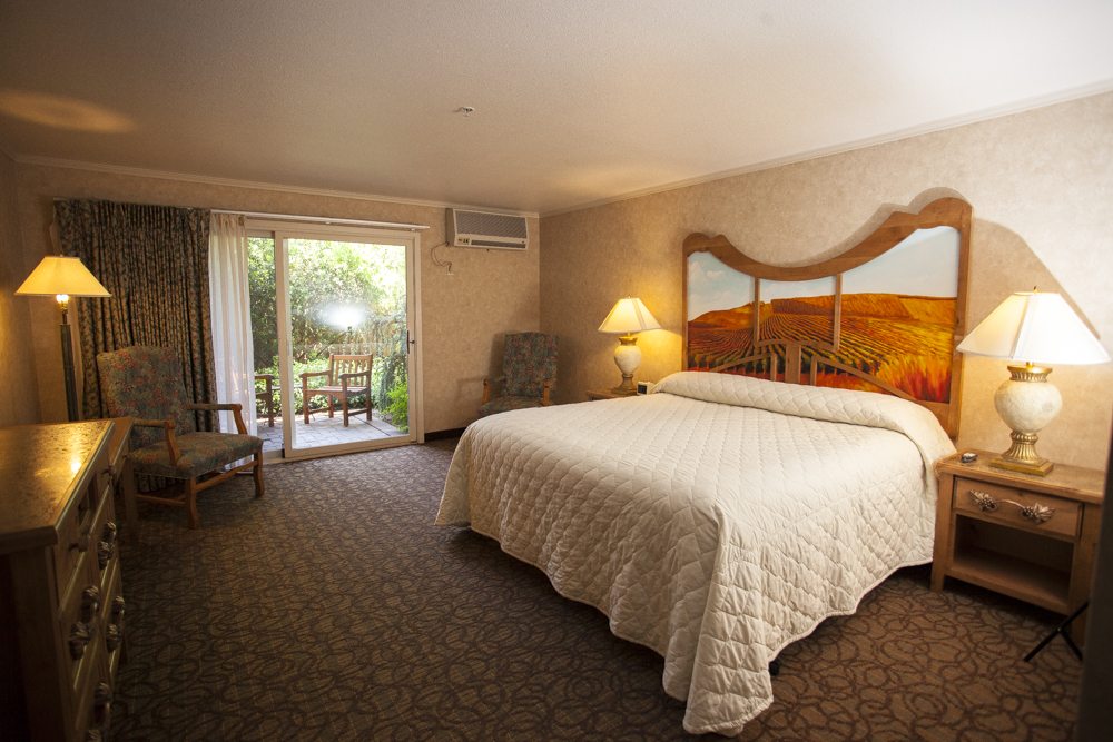 King bed and room at El Bonita Motel