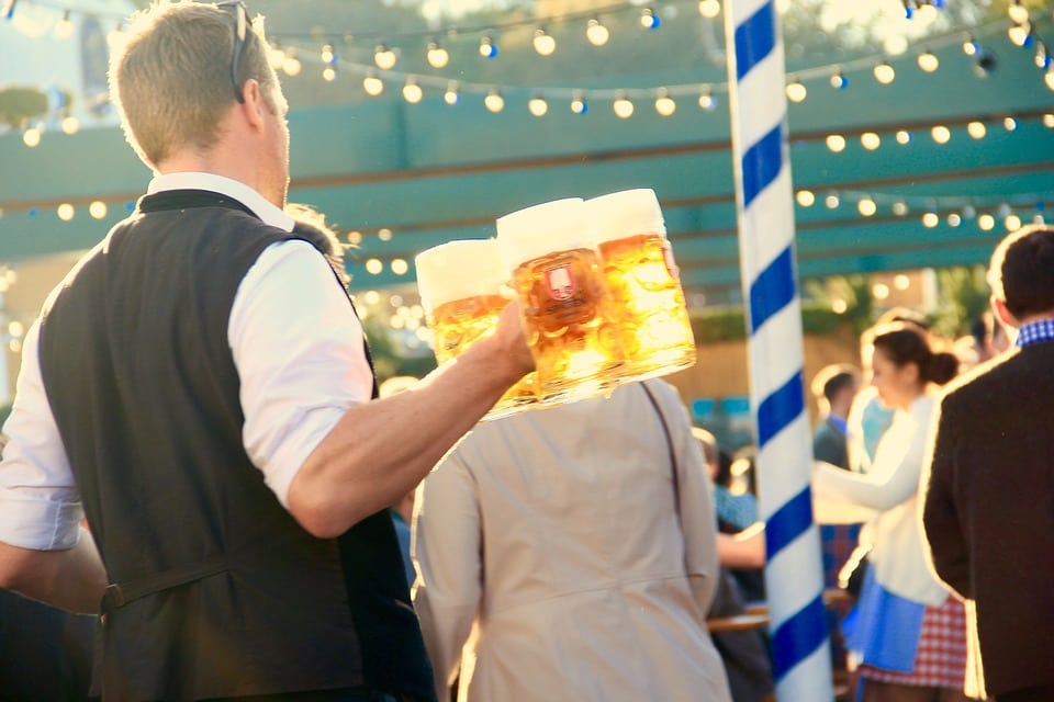 Guy holding beers at Napa Valley Oktoberfest