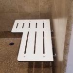 Bench in ADA accessible shower room at El Bonita Motel